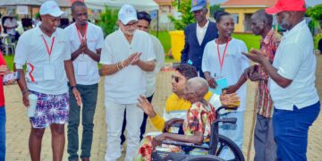 Centenarian Blesses Sudhir Ruparelia After Wheelchair Donation at RR Eye Camp Bukedea